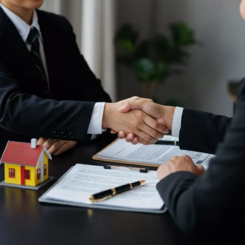 real-estate-agreement-handshake-with-house-model-documents_941011-3783